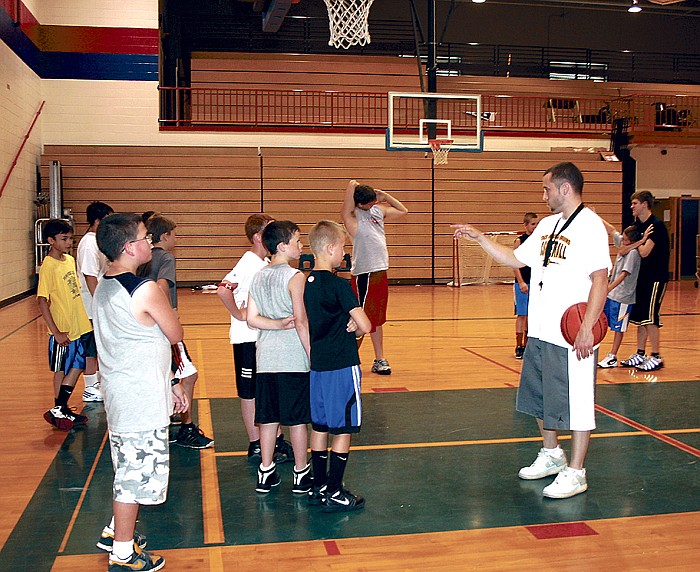 California High School Head Boys Basketball Coach Blair Scanlon instructs boys attending the CHS Boys Basketball Camp for grades 4-6 held June 13-16 at the high school.