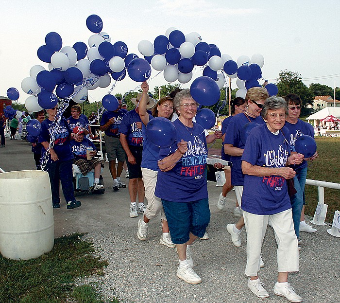 Cancer survivors who attended the 11th Annual Moniteau County Relay for Life Friday, June 17, at the Moniteau County Fairgrounds, California, proudly participate in the Survivor Lap during the opening ceremony.