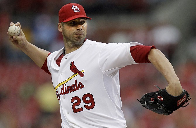 Cardinals starting pitcher Chris Carpenter throws during the first inning of Thursday's game against the Phillies.