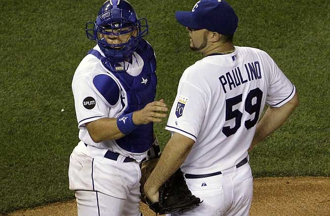 Kansas City Royals starting pitcher Felipe Paulino, right, meets with catcher Matt Treanor on the mound just before Paulino came out of the baseball game during the ninth inning against the Arizona Diamondbacks, Thursday, June 23, 2011, in Kansas City, Mo. The Diamondbacks won the game 3-5 to sweep the Royals in a three-game series. 