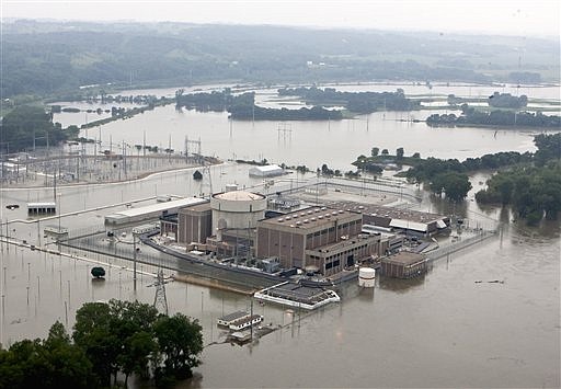 In this June 14, 2011 file photo, the Fort Calhoun nuclear power station, in Fort Calhoun, Neb., north of Omaha, is surrounded by flood waters from the Missouri River. 
