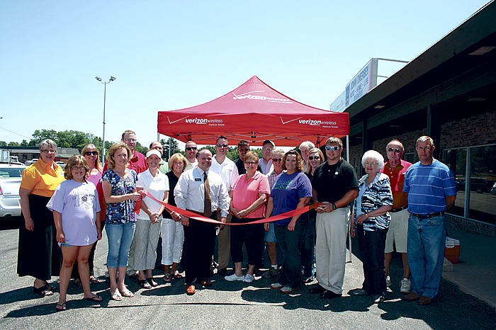 The ribbon-cutting for the California branch of Verizon Wireless, located at Village Green Shopping Center, was held Friday afternoon, where members of the California Chamber of Commerce and City of California Mayor Norris Gerhart, at right, were present to welcome the new business to town. The grand opening for the business, which opened approximately two months ago, was also held Friday.