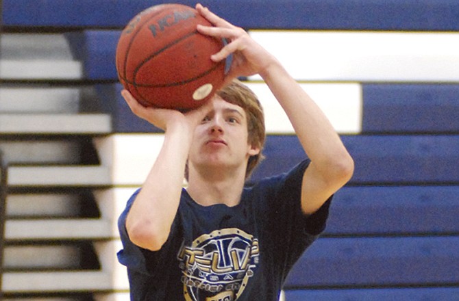 Dylan Gish (Helias High School) takes a shot Thursday during the Lincoln basketball camp at Jason Gym.