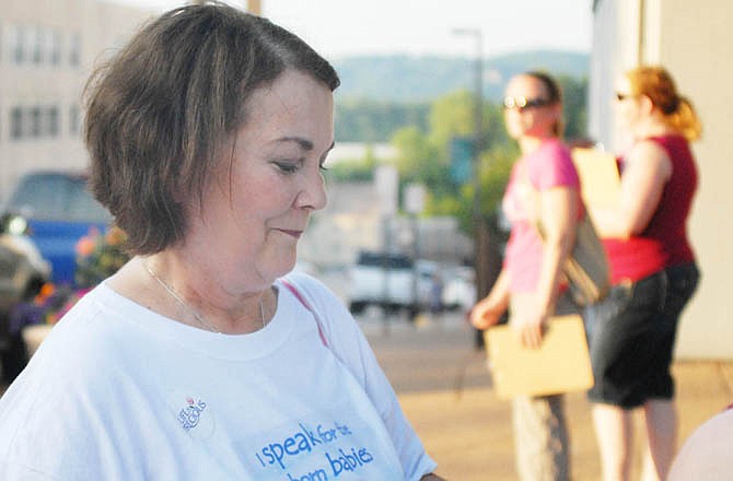 Kathy Forck, campaign director of "40 Days for Life," talks with passersby just outside "Thursday Night Live."