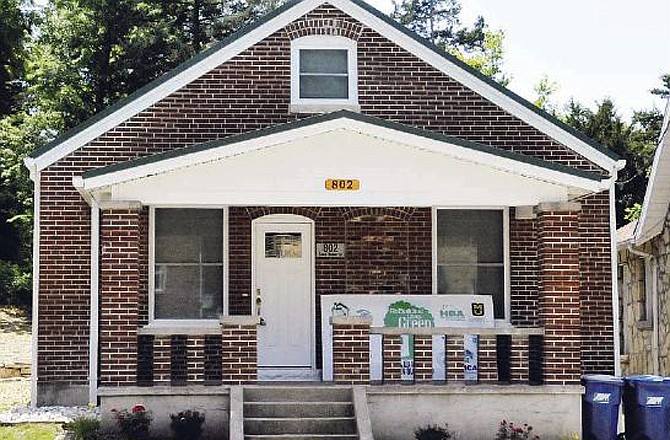 The brick bungalow at 802 E. McCarty St. in Jefferson City has been remodeled into a certified green home. 