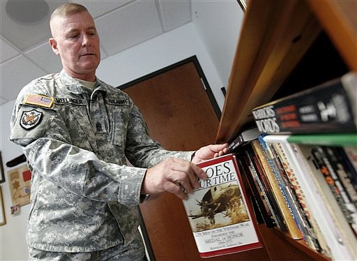 In this photo taken Monday, June 27, 2011, Army Command Sgt. Major Jeffery Mellinger, 58, talks to The Associated Press about his nearly 40-year career in his office in Fort Belvoir, Va. Mellinger, a Vietnam War draftee in 1972, is believed by the Army to be the last conscripted soldier to have served continuously without a break. He is set to retire this summer.