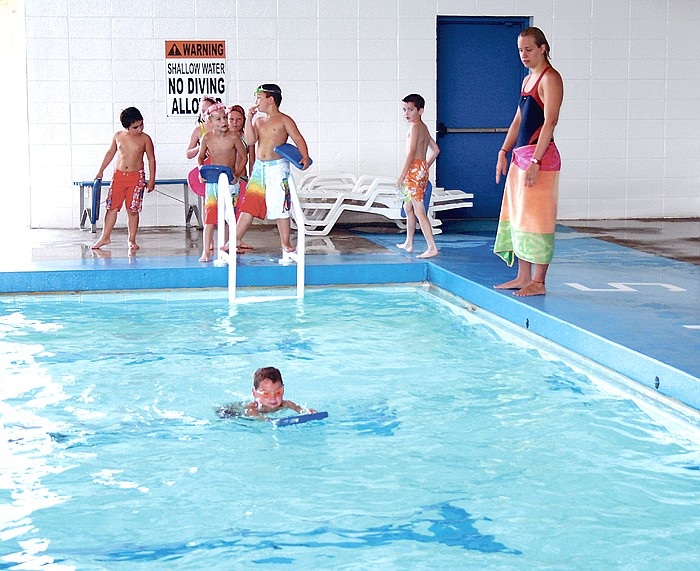 Instructor Angela Weicken, who is also the head lifeguard at the California Pool, works on front kicks with swimmers ages 5-7. Walk said, "The program has gone really well this summer; we've had a good turnout. This particular session is the biggest we've had."