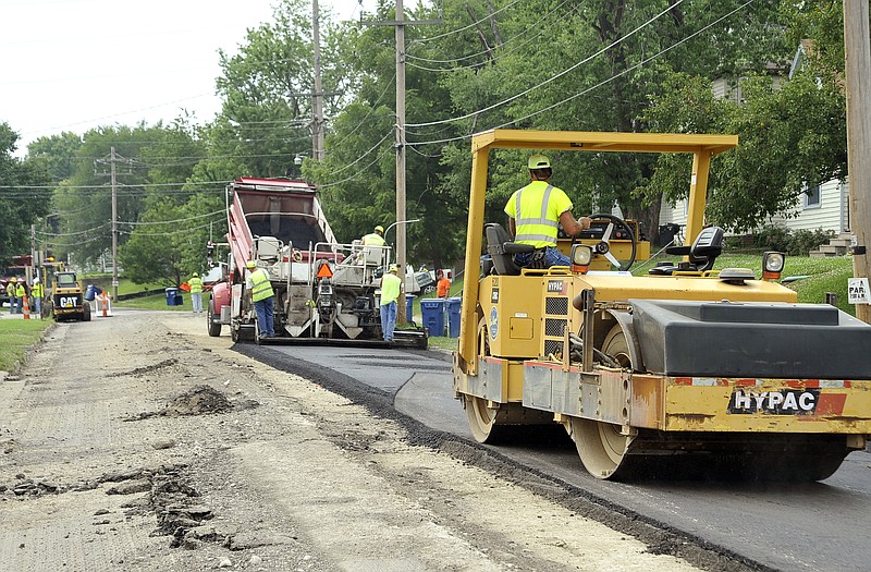 Crews overlay the 900 block of West McCarty on Wednesday as part of the half-cent sales tax yearly expenditures. The city is asking voters to extend the sales tax once again.