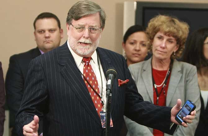 Cheney Mason answers questions after his client, Casey Anthony, was found not guilty in her murder trial in Orlando, Fla., Tuesday, July 5, 2011. Anthony had been charged with killing her daughter, Caylee. 