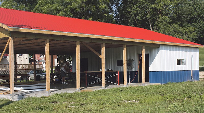 A red, white and blue 40x60 foot pavilion with an enclosed  meeting room and handicapped rest rooms is under construction by American Veterans Post 153 in Mokane. The rest rooms and enclosed serving area are both heated and air conditioned.
