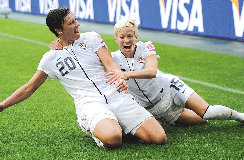 Abby Wamback (20) celebrates with U.S. teammate Megan Rapinoe after scoring during the second half of Wednesday's semifinal against France at the Women's World Cup in Moenchengladbach, Germany.