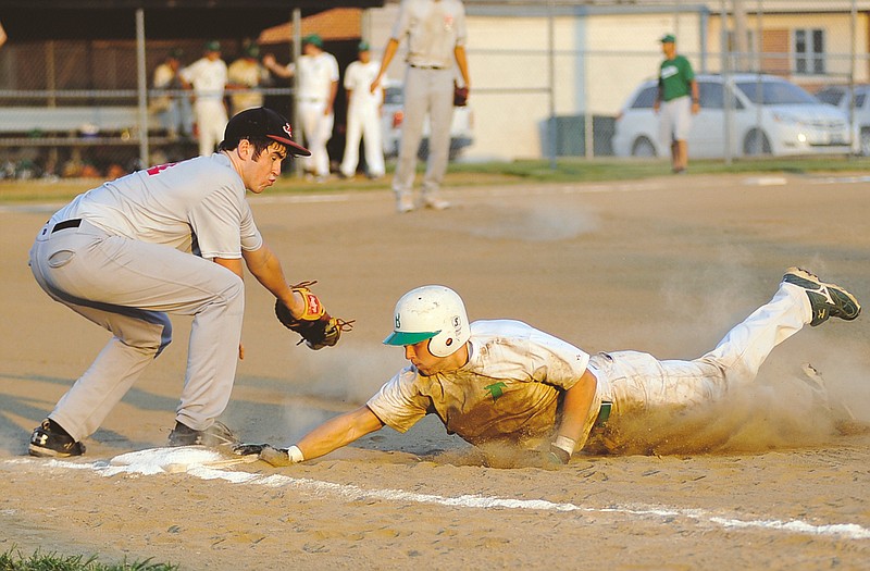 
Blair Oaks' Austin Kempker dives back to first on a pickoff attempt during Friday's game as Jefferson City's Seth Stegeman puts on the tag Friday in Ashland.