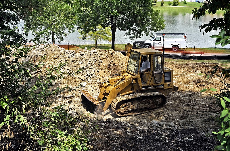 
A bulldozer clears rubble Wednesday where the new playground at McKay Park will be.