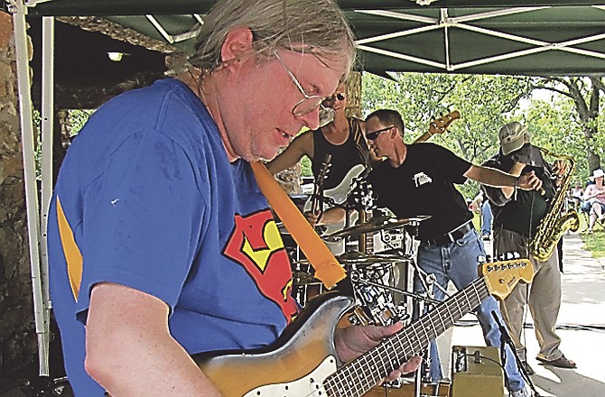 While other band members take a break at the end of a song, Chickenskin Junkies guitarist Robert Duckworth wails on for a few more notes at the end of a song at Blues Sunday, an annual event at McClung Park in Jefferson City.