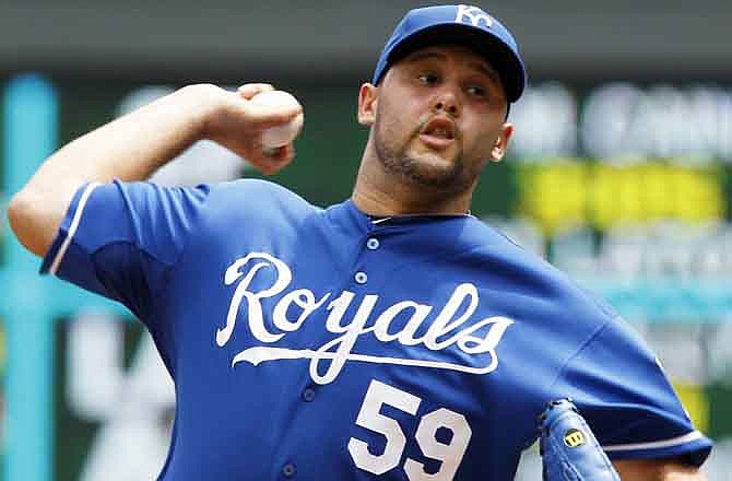 Kansas City Royals pitcher Felipe Paulino throws to the Minnesota Twins in the first inning of a baseball game Sunday, July 17, 2011, in Minneapolis.