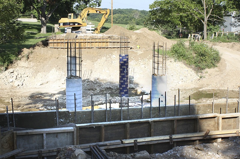 Workmen with the Sam Gaines Construction Co. of New Bloomfield are building a 120-foot bridge two miles east of New Bloomfield along County Road 436. The firm has a $315,129 contract with the Callaway County Road and Bridge Department to build the bridge over Hillers Creek.