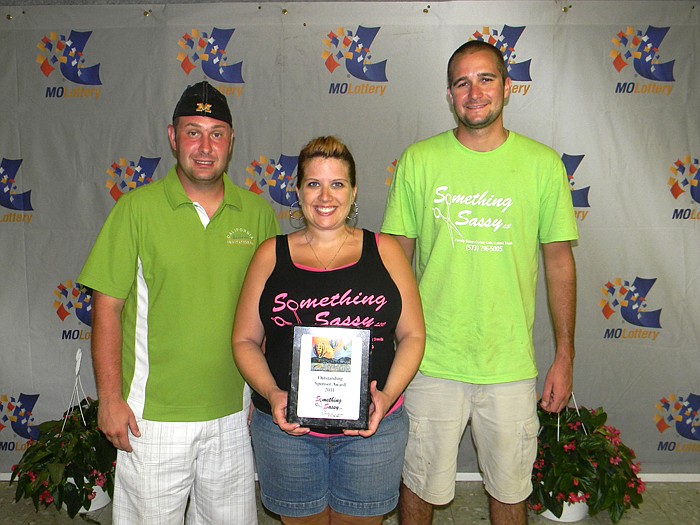 California Balloon Invitational Organizer Ernie Timbrook Jr. presented Something Sassy Salon Owners Stephanie and Andrew Stokes with the "Outstanding Sponsor" award for their support of the invitational.