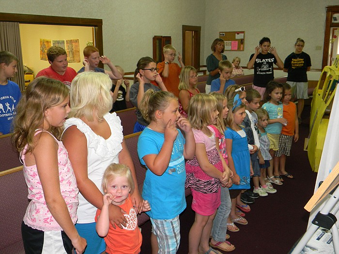 Singing "Big Apple Adventure" are children and volunteers who were a part of the Mt. Pleasant Vacation Bible school held July 11-15.