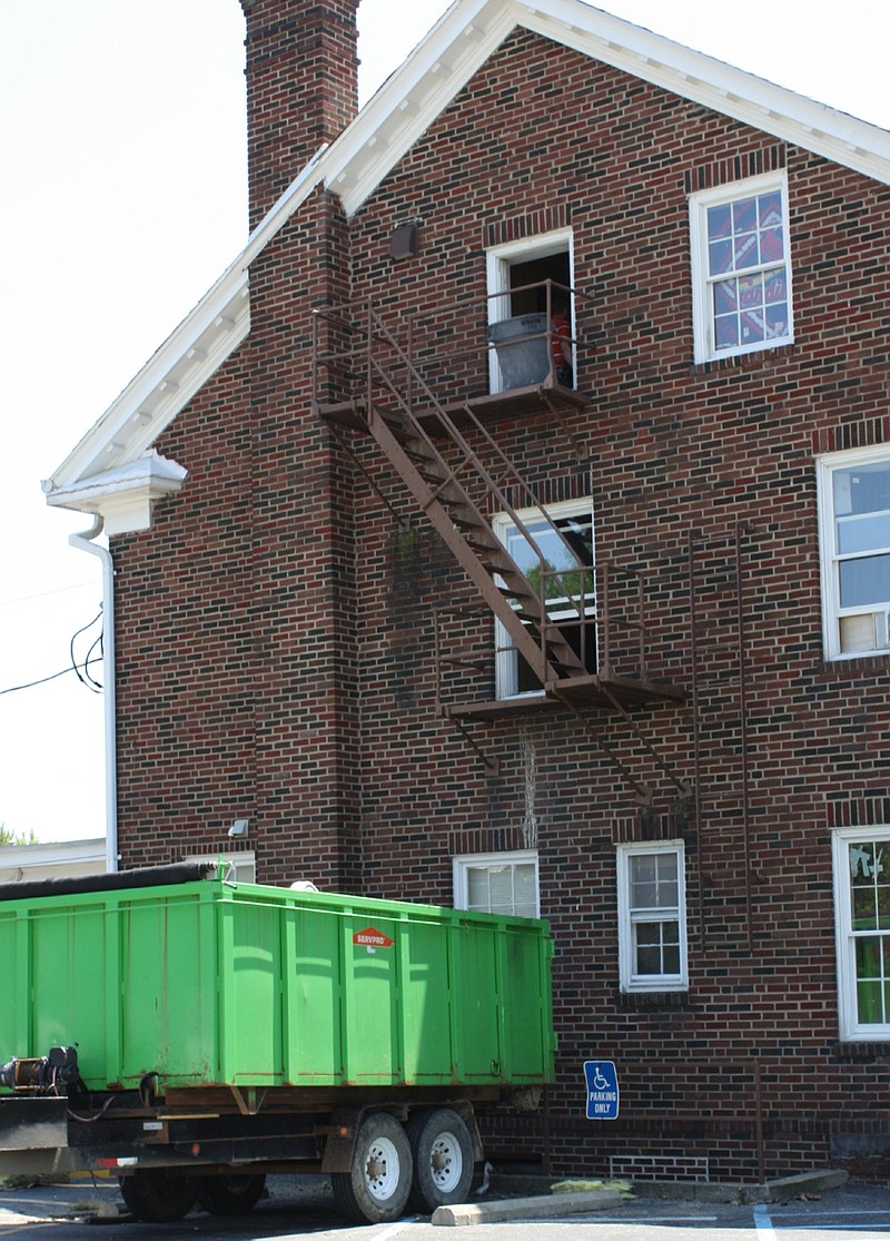 A ServPro truckbed is capturing debris tossed from the third floor of the Kappa Alpha fraternity house, 602 Westminster Ave, Thursday after a 2:40 a.m. fire caused an estimated $100,000 in damages. No one was injured but the house sustained smoke and water damage on on three floors.