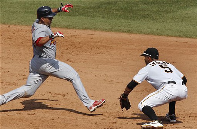 Cardinals catcher Gerald Laird is picked off second base by Pirates shortstop Ronnie Cedeno in the eighth inning of Sunday's game in Pittsburgh.