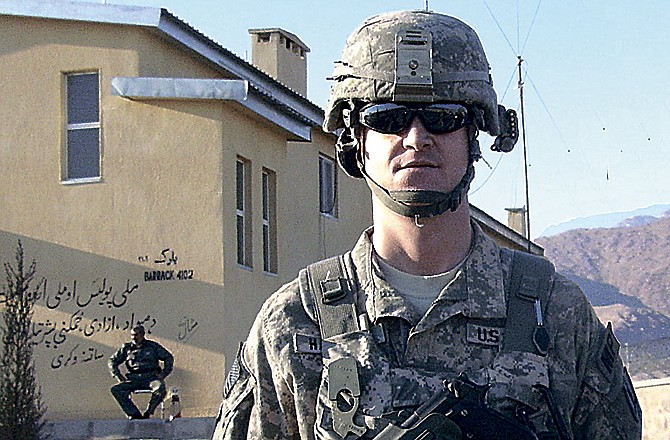 
Capt. Brian Hatcher in front of the Mehtar Lam Police Headquarters, Lahgman Province, Afghanistan, during his recent deployment with the 205th MP Battalion. 