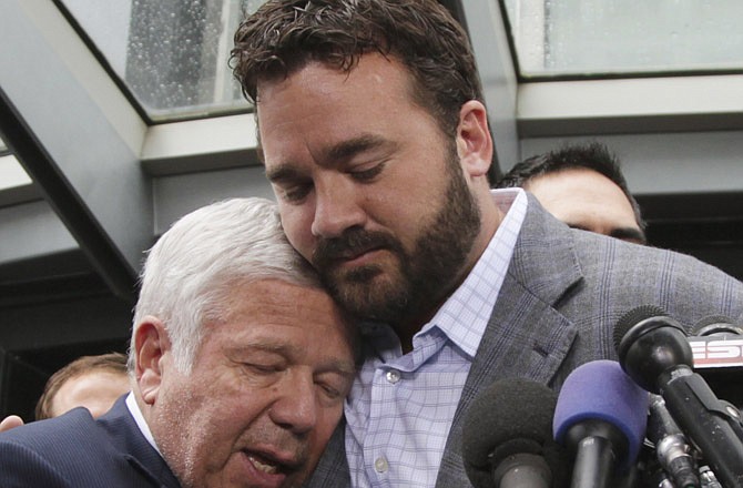 Patriots team owner Robert Kraft is hugged by Jeff Saturday of the Colts during a news conference Monday at the NFL Players Association in Washington.