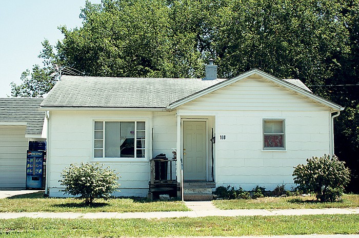 The house above on High Street was a project site for 3MT workers last week, who gave the property a complete paint job, changing the color of the house from yellow to white.