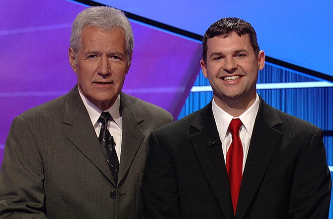 Andrew Bach, Ashland, poses with "Jeopardy!" host Alex Trebek during his appearance on the show.