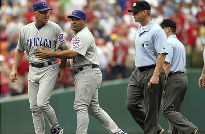 Chicago Cubs manager Mike Quade is ejected after arguing a call by second base umpire Derryl Cousins in the fifth inning of a baseball game against the St. Louis Cardinal at Busch Stadium in St. Louis on Saturday, July 30, 2011. (AP Photo/St. Louis Post-Dispatch, Laurie Skrivan )