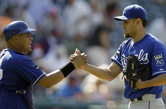 Kansas City Royals relief pitcher Joakim Soria, right, is congratulated by catcher Brayan Pena after they defeated the Cleveland Indians 5-3 in a baseball game on Sunday, July 31, 2011, in Cleveland. 