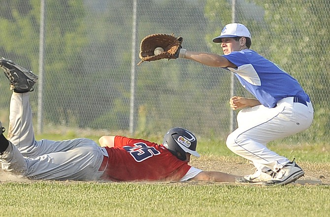 Jefferson City American Legion Post 5 Juniors first baseman Stephen Lehman catches a throw during a game earlier this season against Sedalia at the American Legion Post 5 Sports Complex.