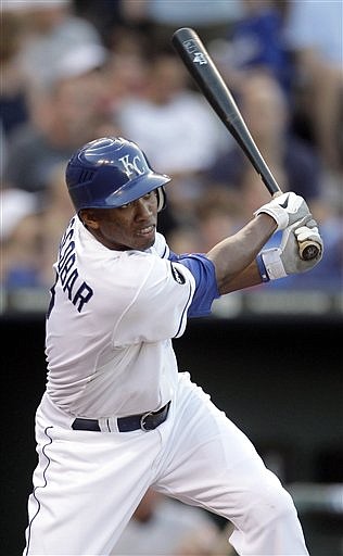 Kansas City's Alcides Escobar follows through on a two-run triple during the second inning of Wednesday night's game against Baltimore in Kansas City.