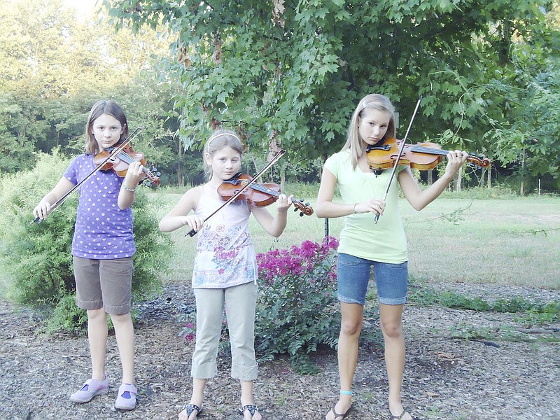 (From left) Carlie, Sophia and Olivia Cunningham have been playing the fiddle - and competing - for several years. The sisters will be participating in the youth division of the Fiddlers Contest at the Kingdom of Callaway County Fair Saturday night.     