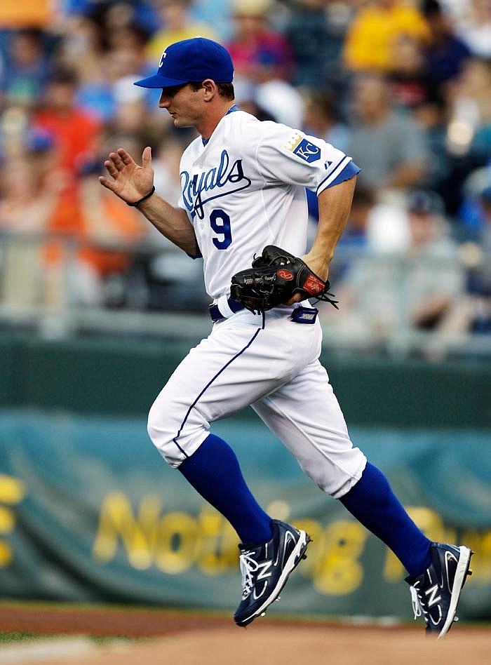 Kansas City Royals second baseman Johnny Giavotella (9) takes the field for his first start during the first inning of a baseball game against the Detroit Tigers in Kansas City, Mo., Friday, Aug. 5, 2011.