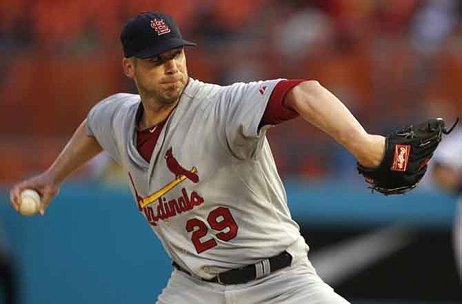 St. Louis Cardinals starting pitcher Chris Carpenter (29) throws in the second inning during a baseball game against the Florida Marlins in Miami, Saturday, Aug. 6, 2011.