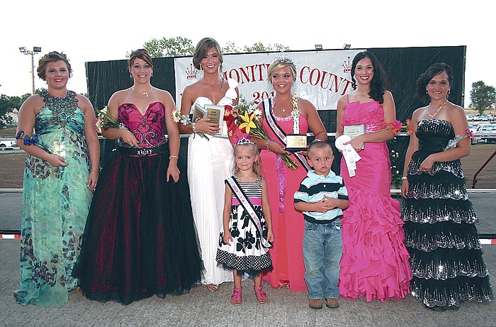 Bailey Glenn, center, was crowned the 2011 Miss Moniteau County Queen Tuesday, Aug. 2, at the main arena of the Moniteau County Fairgrounds. Also in the court, at left, from left, are candidates Pax Baker and Kirstyn Roush, who were both voted "Miss Congeniality", and Kassi Meisenheimer, who won both the Talent and Evening Gown portions of the competition. At right are candidates Kelsey Parrott-Kuhn and Amy Masterson. Standing in front are newly crowned 2011 Little Miss and Mr. Moniteau County Kierstyn Lawson, 5, and Walker Cary, 4.