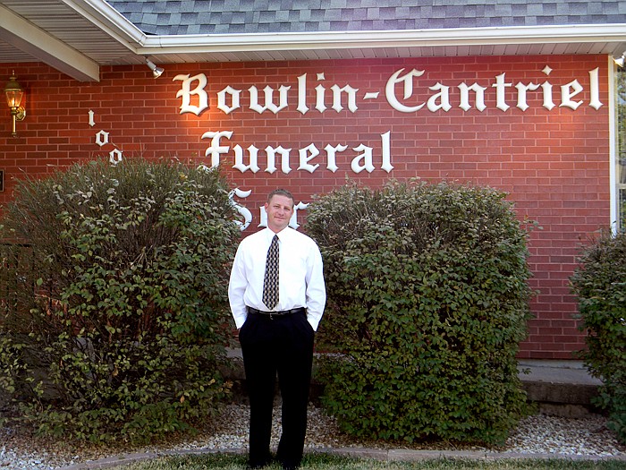 Owner Mark Elliott Jr. in front of Bowlin-Cantriel Funeral Home, located at 100 South Oak Street, California.