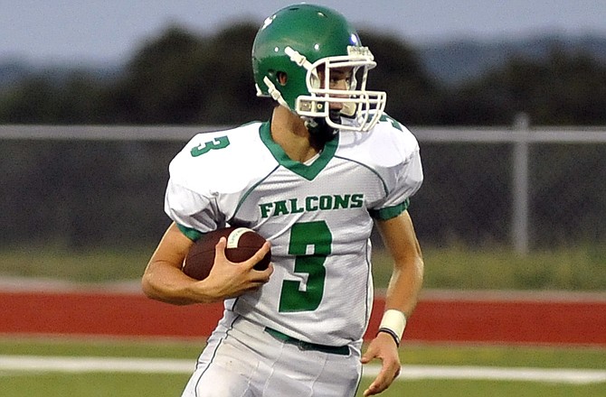 Logan Bax of Blair Oaks takes off with the football during Friday night's scrimmage at the Falcon Athletic Complex in Wardsville.