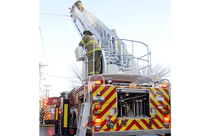 Jefferson City firefighters battled an Elm Street apartment building fire in 2008, as seen in this News Tribune file photo. The tallest building allowed by city building codes is 140 feet, but most buildings are required to be shorter. 