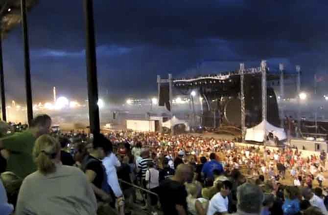 In this Saturday, Aug. 13, 2011 frame grab from video provided by Jessica Silas, a stage is seen moments before it collapses at the Indiana State Fair, killing five and injuring dozens of fans waiting for the country band Sugarland to perform, in Indianapolis. (AP Photo/Jessica Silas)