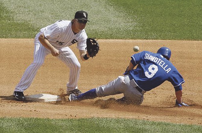 Kansas City Royals' Johnny Giavotella, right, steals second base as Chicago White Sox second baseman Gordon Beckham waits for the ball during the fourth inning of a baseball game in Chicago, Sunday, Aug. 14, 2011.