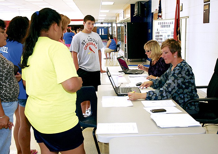 California Guidance Counselors Cathy Hight (at left) and Cara Duenow assist enrolling students. Registration was held throughout the week (Aug. 8-12), with seniors enrolling Monday; juniors, Tuesday; and sophomores, Wednesday. Friday was open for students who were unable to register earlier in the week. The first day of school for California R-1 Schools is Aug. 18.