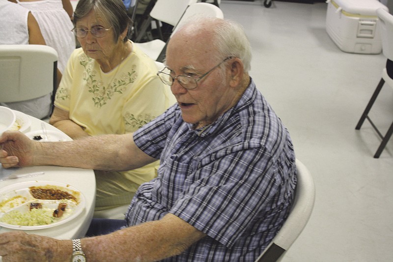 Gilbert Rose, a member of the Mokane Masonic Lodge 612, A.F.& A.M. for the last 50 years, takes in a meal at a dinner at the lodge on Saturday evening.