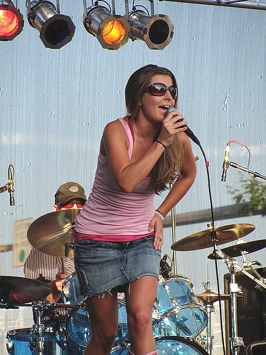 Carissa Dawn Biele, of Fulton, performs at the 2010 Fulton Street Fair. Biele sings country music and performs at different venues around the area.