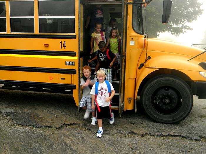 Students arrive at Cole R-I Elementary/Middle School, Russellville, for the first day of classes Thursday, Aug. 18.