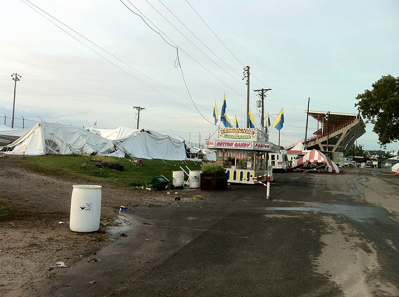 A severe thunderstorm that blew through Sedalia early Friday morning knocked out power to electric customers, including the Missouri State Fairgrounds. Pictured above is some of the aftermath on the fairgrounds seen after sunrise. Events at the fair were canceled until power was restored and the gates were set to reopen at 3 p.m. Friday.