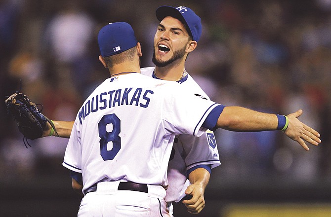 Kansas City Royals third baseman Mike Moustakas (8) and first baseman Eric Hosmer celebrate after winning a baseball game against the Boston Red Sox in Kansas City, Mo., Saturday, Aug. 20, 2011. The Royals defeated the Red Sox 9-4. 