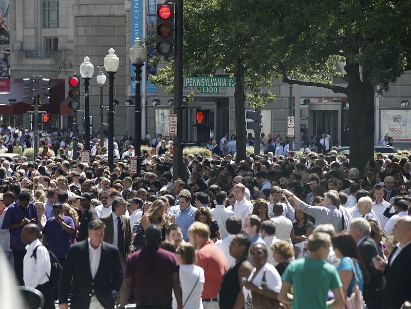 People crowd Pennsylvania Avenue in Washington, Tuesday, Aug. 23, 2011, as they evacuate buildings after an earthquake his the in Washington area. The 5.9 magnitude earthquake centered northwest of Richmond, Va., shook much of Washington, D.C., and was felt as far north as Rhode Island and New York City.