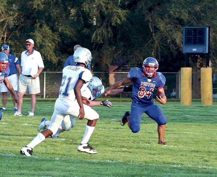 California's Walter Juarez completes a run during the Pintos' scrimmage against Lexington Friday, Aug. 19 at Sedalia.