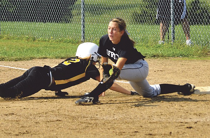 
Jefferson City Lady Jay Hayley Gerber stretches for the ball for an out during a game last season. 